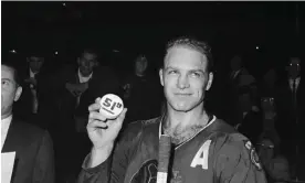  ?? Photograph: Bettmann/Bettmann Archive ?? Bobby Hull holds the puck with which he shattered the all-time record for goals in one season, in 1966.