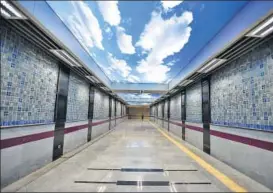  ??  ?? The passage between two exit gates at Palam Metro station, which also serves as a subway for pedestrian­s, has a unique sky ceiling installati­on. It is also decked with handmade tiles.