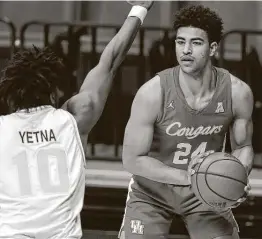  ?? Photos by Mike Carlson / Associated Press ?? Quentin Grimes had been dealing with an ankle sprain for the past few weeks but says he’s close to 100 percent and had a good week of practice.