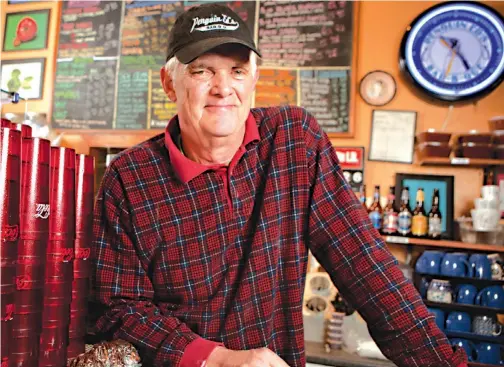  ??  ?? Ed Knight has been serving his amazing barbecue to Fayettevil­le natives and others for 24 years