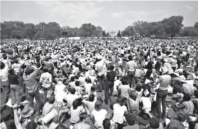  ?? Associated Press ?? ■ In this Aug. 28, 1963, file photo, crowds gather at the Lincoln Memorial to demonstrat­e for the civil rights movement in Washington. More than five decades after Americans poured into the streets to demand civil rights and the end to a deeply...