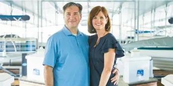  ?? KELLY BLACKMON/THE NEW YORK TIMES ?? Amy and Peter Lyle at the dock where they keep their boat in Georgia. The couple have canceled three trips since the start of the pandemic.