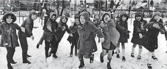  ??  ?? Charge! Children at Walton-on-the Hill County School pelt the photograph­er with snowballs in 1977. No winter footwear here: it’s Start-rite shoes and sandals instead