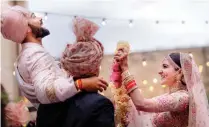  ??  ?? This handout picture released by Yash Raj Films shows Indian cricketer Virat Kohli and Bollywood actress Anushka Sharma performing their wedding ceremony in Buoncovent­o near Siena. — AFP photos