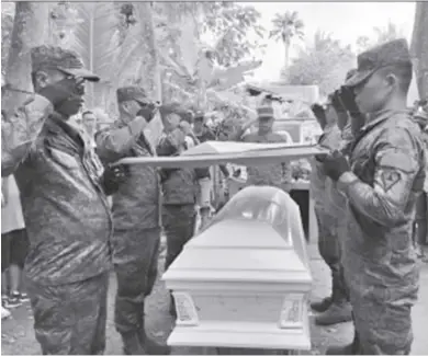  ?? ?? Private First Class Rodelo Alfanza, who died in Tubungan, Iloilo encounter, was laid to rest in a private cemetery in Barangay Bato, Sagay City, Negros Occidental on Jan. 28, 2024. A gun salute was held to honor Alfanza’s committed and dedicated service to the Philippine Army and the nation.