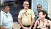 ??  ?? MUGGED: American tourists Anna Possek and Igor Gitelman being helped by Warrant Officer Annie Ganas and Warrant Officer Julian Pillay from the Diplomatic Police Unit at Point Police Station yesterday.