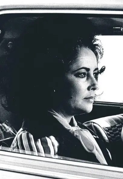  ??  ?? Elizabeth Taylor and Guido Mannari in the film version of The Driver’s
Seat, released as Identikit in 1974. Spark said Taylor was less like a woman looking to be murdered and more like someone in want of a Martini