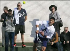  ?? DARKO VOJINOVIC — THE ASSOCIATED PRESS ?? Serbian tennis player Novak Djokovic serves the ball during his open practise session in Belgrade, Serbia, Wednesday.