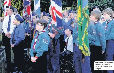  ??  ?? Tributes Youngsters remember the war dead in Cambuslang last year