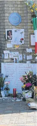  ?? Pictures: PA. ?? A passer-by looks at tributes left to the victims outside Notting Hill Methodist Church near to Grenfell Tower in west London.