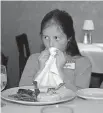  ?? VON DER GROEBEN/CONTRA COSTA TIMES] ?? Hope Wortham, 9, a fifth grader at Walnut Grove Elementary in Pleasanton, Calif., practices manners as part of the school's first etiquette class. [NORBERT