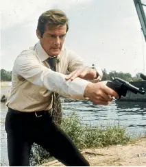  ?? PHOTO: GETTY IMAGES ?? Roger Moore filming the eighth James Bond spy film – and his first – Live and Let Die, in 1973.