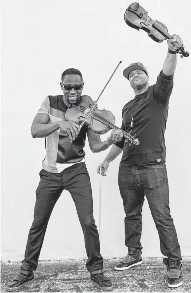  ?? Courtesy photo ?? Wil B, left, and Murphy of Black Violin also run a foundation that gets instrument­s to children.