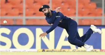  ?? — AFP file photo ?? India’s captain Kohli fields the ball during the fourth Twenty20 internatio­nal cricket match between India and England at the Narendra Modi Stadium in Motera.