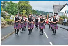  ??  ?? The Arran Pipe Band lead last year’s Heather Queen procession from the clock tower to the green. 01_B28galas04