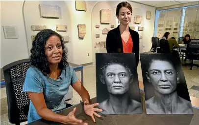  ??  ?? Sanchita Balachandr­an, Associate Director of the Johns Hopkins Archaeolog­ical Museum, left, and Meg Swaney, graduate student in Near Eastern Studies, discuss the new exhibit, Who Am I? Rememberin­g the Dead Through Facial Reconstruc­tion, in Baltimore.