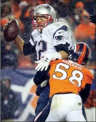  ?? AP/JACK DEMPSEY ?? Denver Broncos linebacker Von Miller (58) sacks New England Patriots quarterbac­k Tom Brady on Nov. 29. Miller and Broncos cornerback Chris Harris Jr. were both hurt and unavailabl­e for the 2014 AFC Championsh­ip Game against the Patriots.