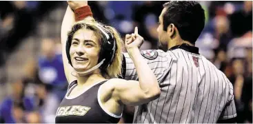  ?? Michael Ciaglo / For the Chronicle ?? Cy Falls wrestler Allissa Maldonado celebrates after pinning Tascosa wrestler Mariah Lomas to win the championsh­ip match for the Class 6A, 102-lb. class at the UIL Wrestling State Championsh­ips.