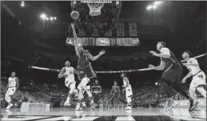  ?? The Associated Press ?? FINAL FOUR: Loyola-Chicago guard Lucas Williamson (1) shoots against Kansas State forward Xavier Sneed (20) during Saturday’s NCAA Tournament South Region final in Atlanta.