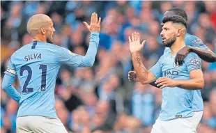  ?? Picture: Getty. ?? David Silva and Sergio Aguero celebrate another city goal.