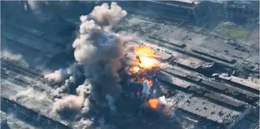  ?? ?? Pounded: The Azovstal plant in Mariupol erupts in flames in footage released by pro-Russian forces yesterday