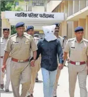  ?? PTI PHOTO ?? The main accused in the Junaid Khan lynching case being produced in Faridabad district court on Sunday.