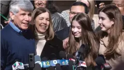  ?? ASHLEE REZIN GARCIA/ SUN- TIMES ?? LEFT: Former Gov. Rod Blagojevic­h celebrates his release from prison with wife, Patti, and daughters, Annie and Amy, outside the family’s Ravenswood Manor home on Feb. 19.