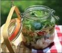  ??  ?? Layered Caprese Salad can be packed in a jar and tossed into a cooler.