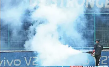  ?? — IPL ?? A groundsman fumigates the Arun Jaitley Stadium in Delhi.