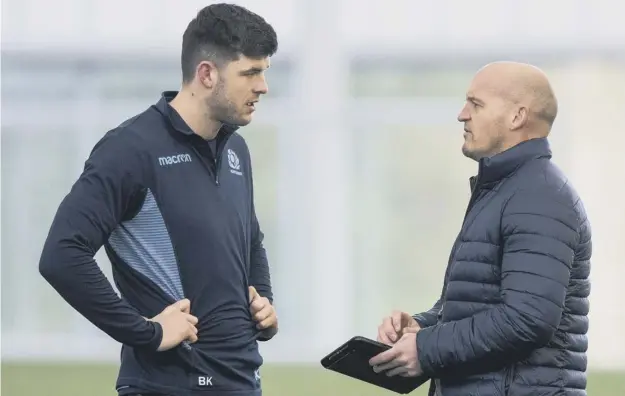  ??  ?? 0 Gregor Townsend, right, talks to winger Blair Kinghorn at training. The Scotland coach dropped last week’s hat-trick hero to make way for Sean Maitland against Ireland.
