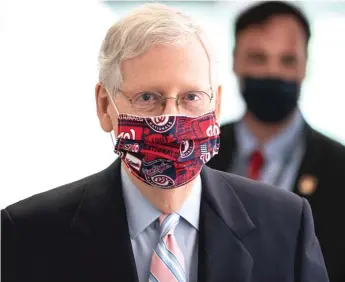  ?? DREW ANGERER/GETTY IMAGES ?? Senate Majority Leader Mitch McConnell, R-Ky., arrives Tuesday on Capitol Hill, where he and Trump administra­tion officials would discuss a new coronaviru­s economic stimulus package.