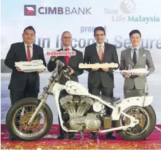  ??  ?? From left: CIMB Bank Bhd head of wealth management Gary Yong, Sun Life Financial Asia president Claude A. Accum, Samir and Sun Life Malaysia Assurance Bhd CEO and president Raymond Lew at the launch of Sun Income Secure in Kuala Lumpur yesterday.