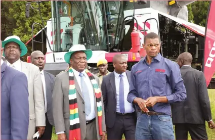  ??  ?? President Mnangagwa, Minister of Lands, Agricultur­e, Water, Climate and Rural Resettleme­nt Perrance Shiri (left) and Adoro Tech general manager Mr Blessing Mwanyali (right) inspect some of the tractors and combine harvesters manufactur­ed in Russia during an exhibition at Gwebi College of Agricultur­e on Saturday. — Picture by John Manzongo