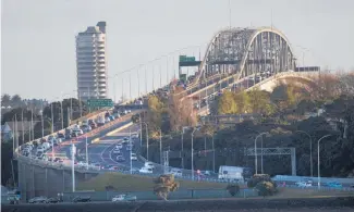  ?? Photo / Brett Phibbs ?? Weather- permitting the Auckland Harbour Bridge will be partially closed tonight as a temporary strut is replaced by a permanent one.