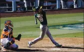  ?? PHOTO BY HARRY HOW — GETTY IMAGES ?? The A’s Chad Pinder hits a three-run home run against the Houston Astros during the seventh inning in Game 3 of the ALDS at Dodger Stadium on Wednesday.