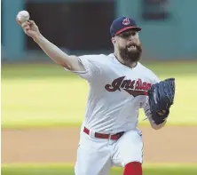  ?? AP PHOTO ?? DIALED IN: Indians ace Corey Kluber delivers to the plate during his masterful complete game shutout victory over the Angels last night in Cleveland.