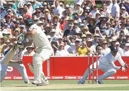  ??  ?? Hard at it: Graeme Swann snatches a catch at second slip to dismiss a nervous Ricky Ponting