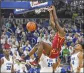  ?? Associated Press ?? USC’s Chevez Goodwin (center) dunks over Florida Gulf Coast’s Austin Richie (32), Kevin Samuel (21) and Cyrus Largie (4) during the first half on Tuesday in Fort Myers, Fla. The Trojans won 78-61.