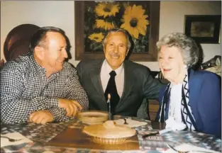  ?? Courtesy photo ?? Gene Sanchez with his parents, Joe A. and Mary L. Sanchez, at their home in Taos.