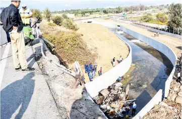  ??  ?? Turkish police forensic experts examine the wreckage of the truck after it crashed in Izmir. — AFP photo