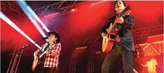  ??  ?? ‘Sertanejo’ music style duo ‘Chitaozinh­o e Xororo’ performs. — AFP photos