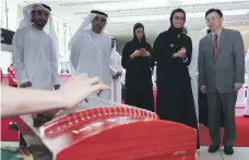  ?? Victor Besa / The National ?? Noura Al Kaabi and Ni Jian toured the attraction­s at the launch of UAE-China Week at Manarat Al Saadiyat