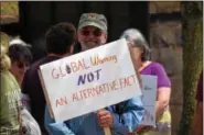  ?? MARIAN DENNIS — DIGITAL FIRST MEDIA ?? A rally-goer pokes fun at the idea of “alternativ­e facts” during a march in Pottstown Saturday. The event was aimed at bringing change to current environmen­tal policy.