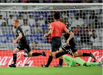  ??  ?? Team Wellington midfielder Aaron Clapham celebrates his goal that put his side 2-0 up against Al Ain in the Club World Cup first-round playoff.