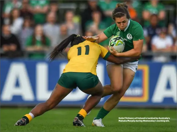  ??  ?? Katie Fitzhenry of Ireland is tackled by Australia’s Mahalia Murphy during Wednesday’s exciting win.