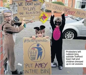  ??  ?? Protesters left rubbish bins outside Trafford town hall and children dressed up in rat onesies