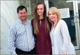  ?? CONTRIBUTE­D PHOTO ?? Former foster child Lily Sollicito, center, surrounded by Thomas and Allison Sollicito, who adopted Lily on Thursday. Lily had been in foster care with the Sollicito’s for more than a year.