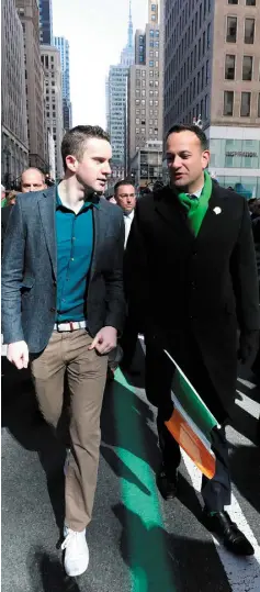  ??  ?? TOGETHER: Taoiseach Leo Varadkar (right) and partner Matt Barrett walk in the St Patrick’s Day parade on 5th Avenue in New York City. Photo: Niall Carson/PA Wire