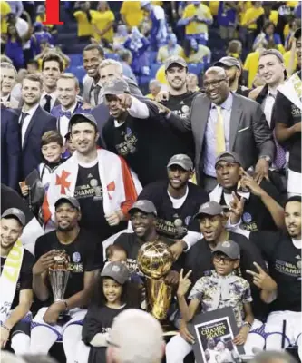  ?? — AP ?? OAKLAND: Golden State Warriors players, coaches and owners pose for photos after Game 5 of basketball’s NBA Finals against the Cleveland Cavaliers in Oakland, Calif., Monday. The Warriors won 129-120 to win the NBA championsh­ip.