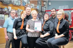  ??  ?? ●●Staff at Robinson’s Visitors Centre in Stockport with the award